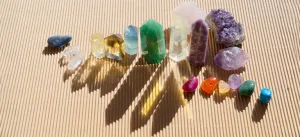 Array of crystal necklaces including amethyst, rose quartz, and citrine