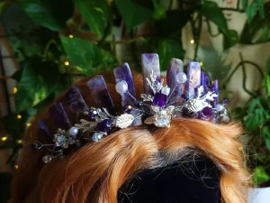 Close-up of a crystal crown featuring quartz, amethyst, and emerald