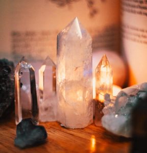 Customer purchasing crystals at the counter of a local crystal store