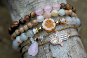 Stacked crystal bead bracelets and other matching jewelry