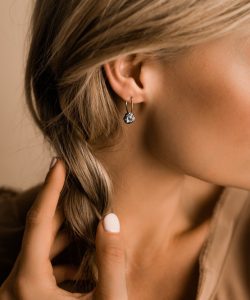 Woman wearing Crystal Brown drop earrings