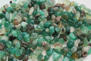 A close-up of polished Green Aventurine stones