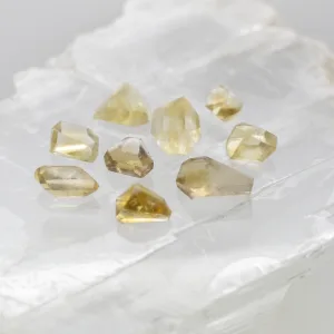 A collection of polished Citrine stones in various shapes