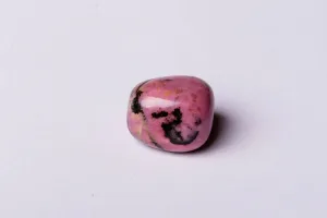 Rhodonite stones arranged in a circle for meditation