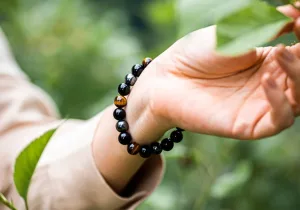 Person Holding Black Obsidian